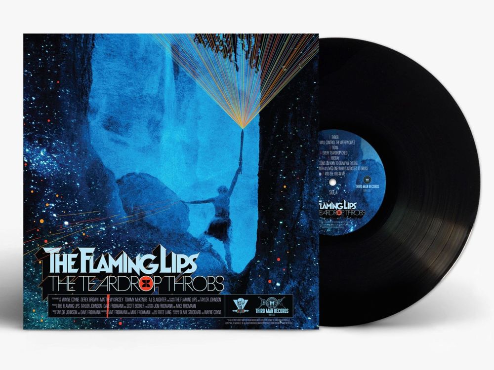 the album cover for The Flaming Lips - The Teardrop Throbs [Black]