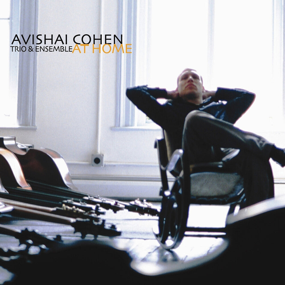 the album cover for Avishai Cohen  / Guiliana,Mark / Tzur,Tomer - At Home
