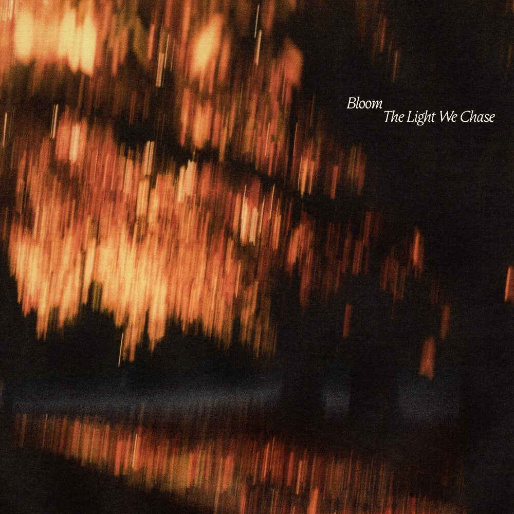 the album cover for Bloom - The Light We Chase [Indie Exclusive Black Ice/Blood Red LP]