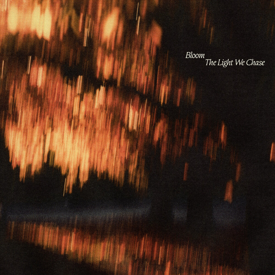 the album cover for Bloom - The Light We Chase [Indie Exclusive Black Ice/Blood Red LP]