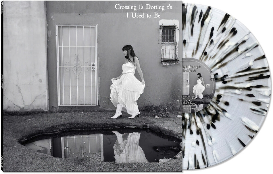 the album cover for Crossing I's Dotting T's - I Used To Be [BLACK/WHITE/CLEAR SPLATTER]